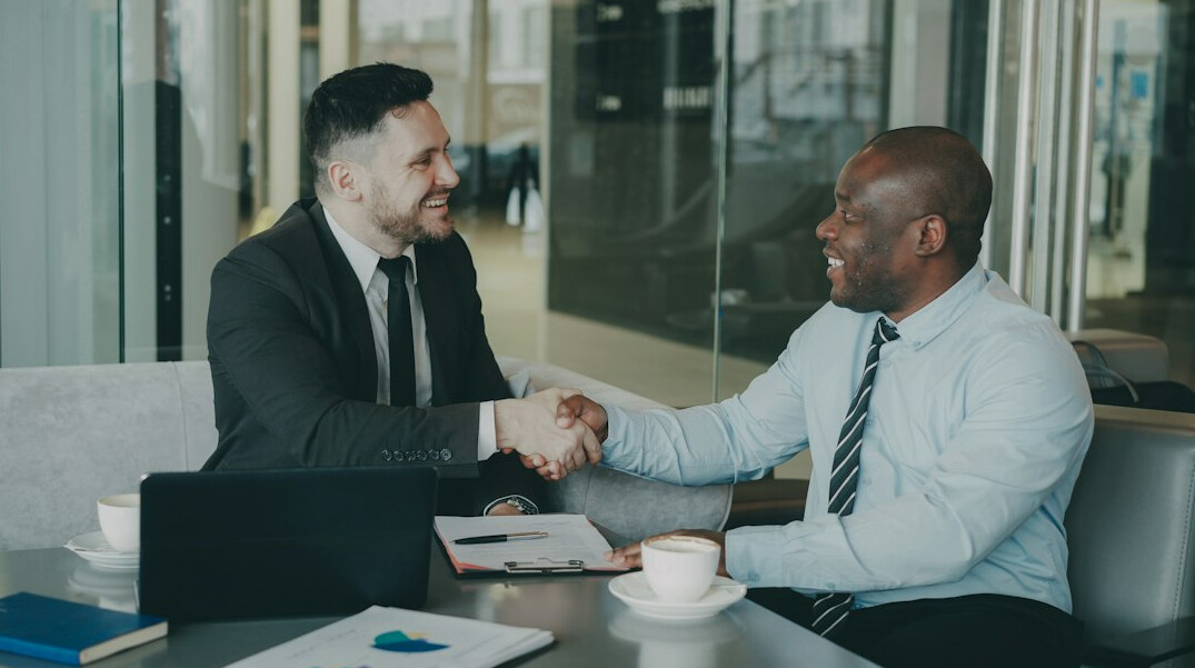 business executives shaking hands