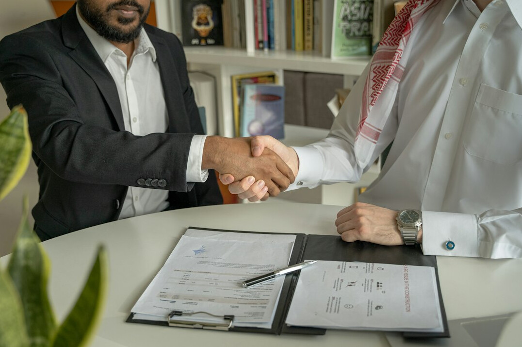 executives discussing contract